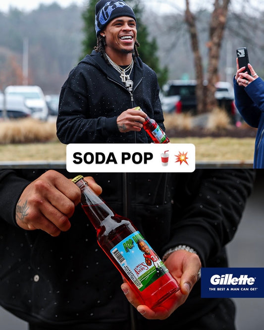 Pop Douglas, Patriot's Football Wide Receiver, holding a bottle of his custom Avery's soda pop walking into Gillette Stadium.