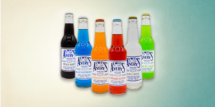 Collection of Avery’s Classic Sodas in glass bottles on gradient teal background