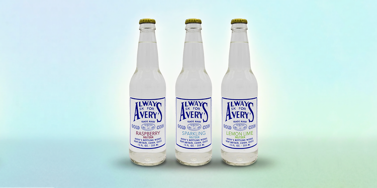 Collection of Avery’s Seltzers in glass bottles on gradient blue background