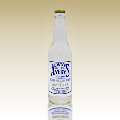 Avery's Birch Beer in glass bottle on beige gradient background