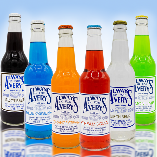 Avery’s Classic Variety 12-Pack with a variety of classic flavors in glass bottles on blue gradient background