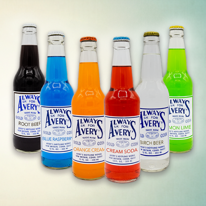 Avery’s Classic Variety 12-Pack with a variety of classic flavors in glass bottles on gradient background