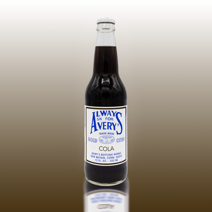 Avery's Cola in glass bottle on brown gradient background