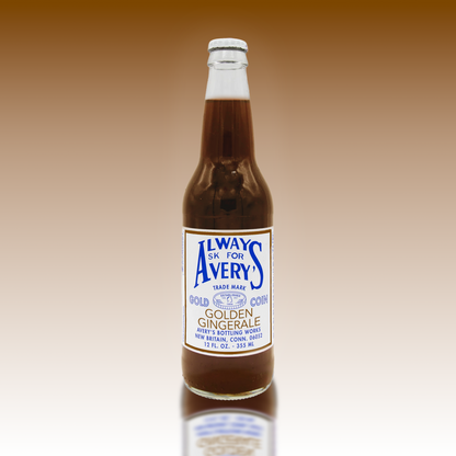 Avery’s Golden Ginger Ale in glass bottle on golden gradient background
