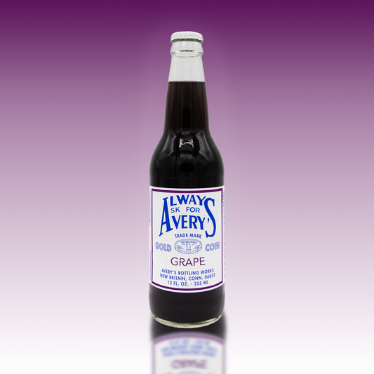 Avery's purple Grape Soda in glass bottle on purple gradient background
