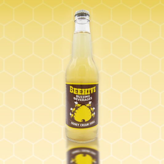 Avery’s Honey Infused Cream Soda in glass bottle on yellow gradient background