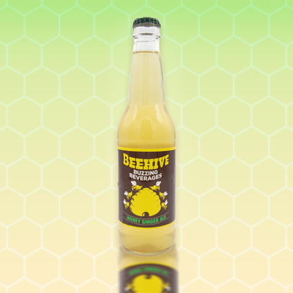 Avery’s Honey Infused Ginger Ale in glass bottle on yellow and green gradient background