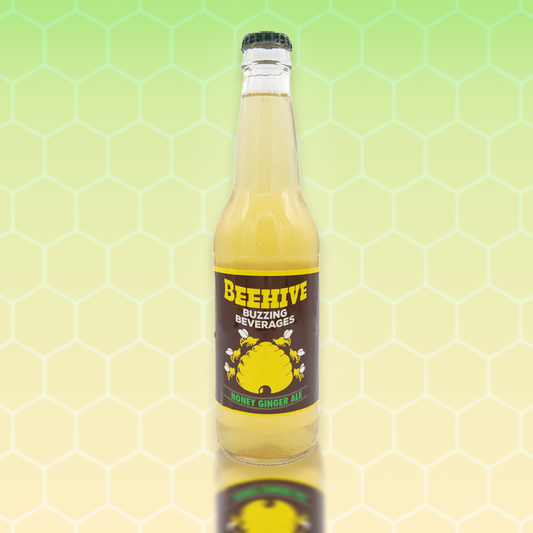 Avery’s Honey Infused Ginger Ale in glass bottle on yellow and green gradient background