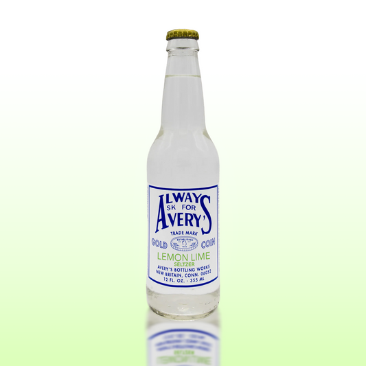 Avery’s Lemon Lime Seltzer in glass bottle on green gradient background