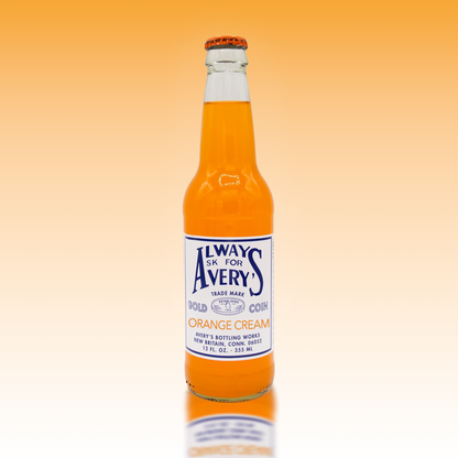 Avery's Orange Cream Soda in glass bottle on orange gradient background