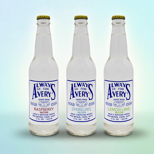 Avery’s Soda Seltzers Variety 12-Pack with Raspberry, Lemon Lime, and Sparkling flavors in glass bottles on blue gradient background
