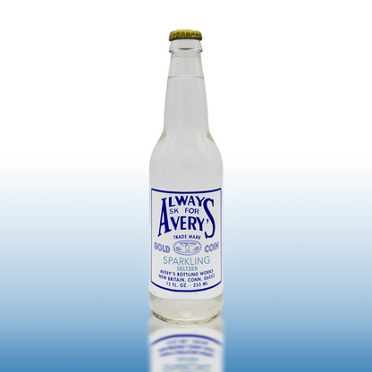 Avery’s Sparkling Seltzer in glass bottle on blue gradient background